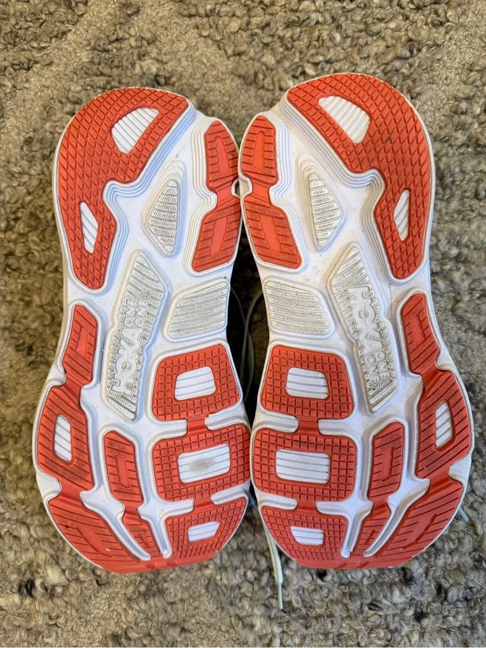 Hoka Pale Gray Running Shoes with orange Accents